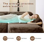 Woman lying on chocolate plush modular sofa using armrest for extra support, highlighting pet-friendly and soft-touch features.