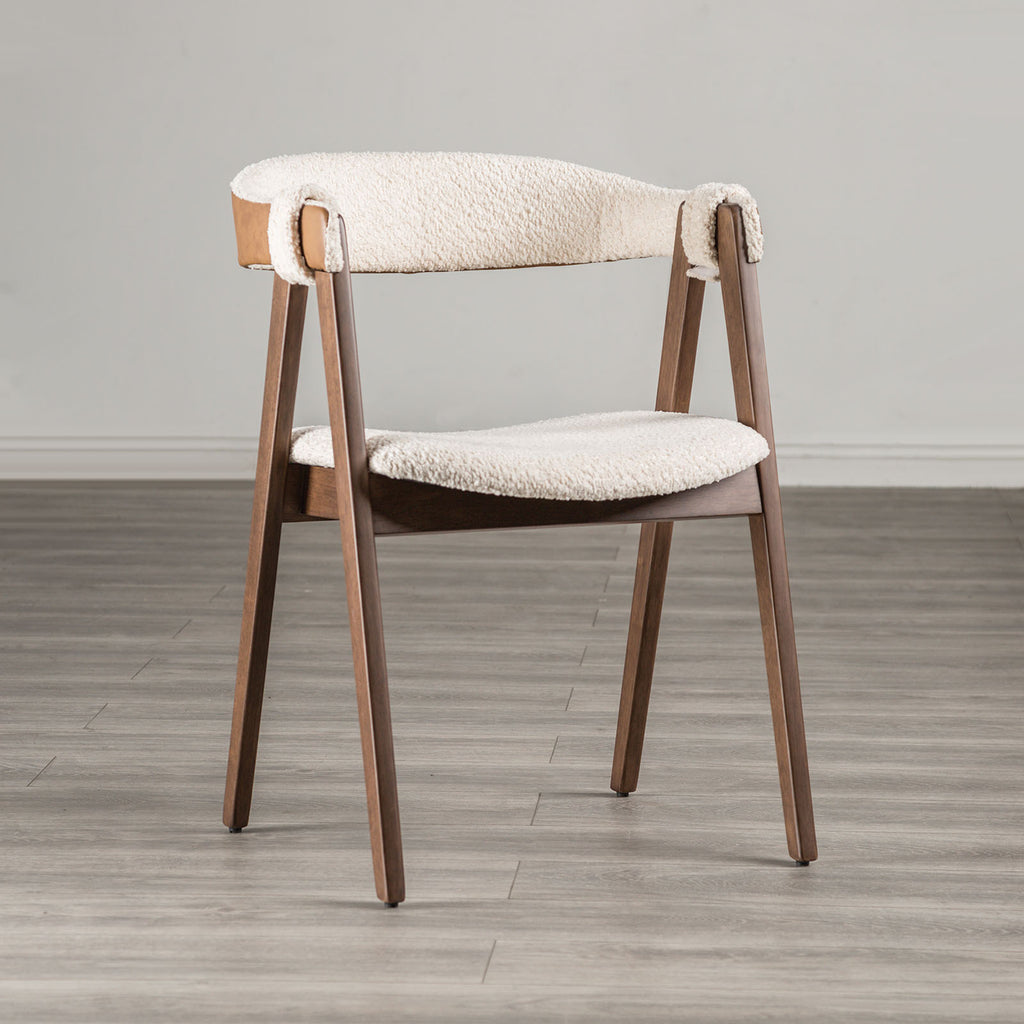 Mid-Century Modern Side Chair in Walnut & Beige with boucle fabric, curved backrest, and angled wooden legs on a wood floor.