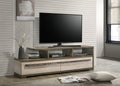 Modern wood TV stand with open shelving and drawers in a living room setup, supporting a flat-screen TV and decorative items.