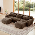 Modular U-shaped sofa in plush chocolate fabric with ergonomic cushions and ottomans, ideal for modern living rooms and seats up to 3 people.
