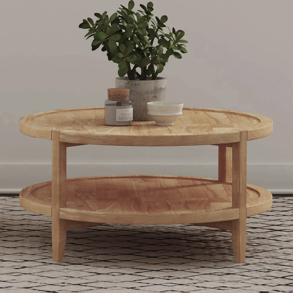 Maple Brown Round Wooden Coffee Table styled in a living room with decor on top, showcasing its bottom shelf for added storage.