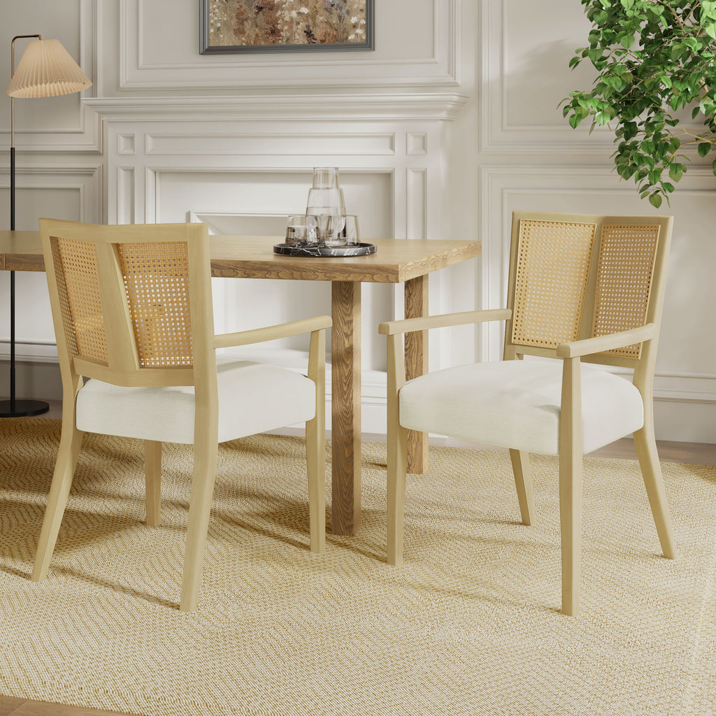 Mid-century modern rattan back dining chairs in a styled dining room setting, featuring comfy foam seats and light wood frames.