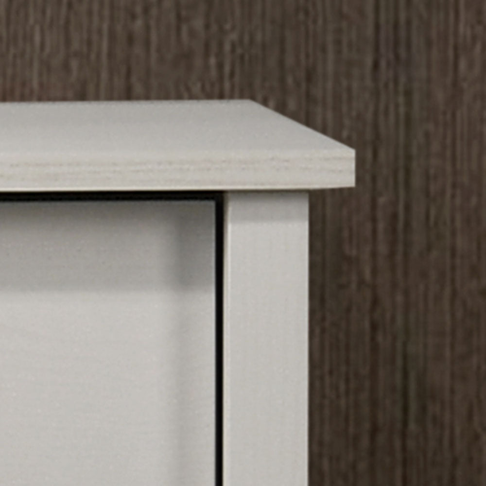 Top corner detail of white dresser highlighting smooth finish and precise craftsmanship. Complements minimalist bedroom decor.