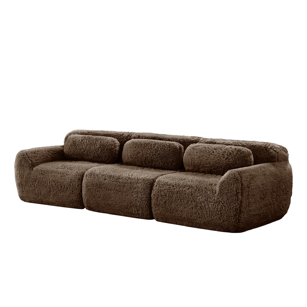 Side angle of 114'' modular sofa in chocolate plush, highlighting its curved armrests and modular build.