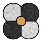Top-down view of Four-Leaf Clover Accent Table showing the symmetrical clover design with black, white, and gold terrazzo.