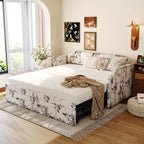 Upholstered twin daybed featuring a black-and-white botanical print, pop-up trundle, and integrated USB charging ports.