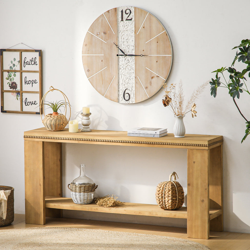 Wooden console table with decorative items and a wall clock in a room setting.