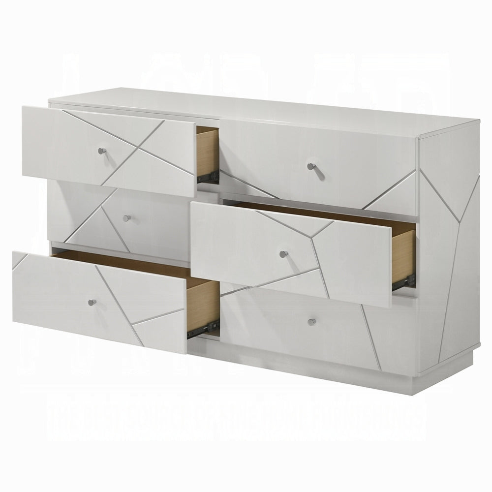 Modern white dresser with 6 drawers partially open, showing interior storage space. Embossed lines and metal knobs enhance ultra modern style.
