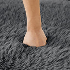 Hand pressing into the plush fabric of the Modular Sofa - Dark Grey, demonstrating its softness and comfort.