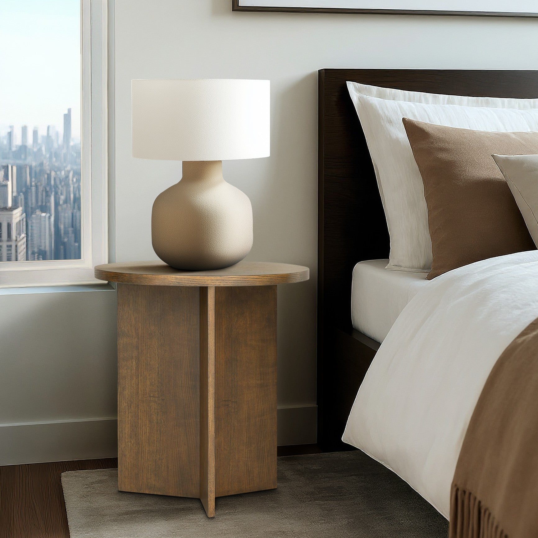Sadie Walnut Brown Accent Table used as a nightstand in a contemporary bedroom, showcasing its compact design for small spaces.