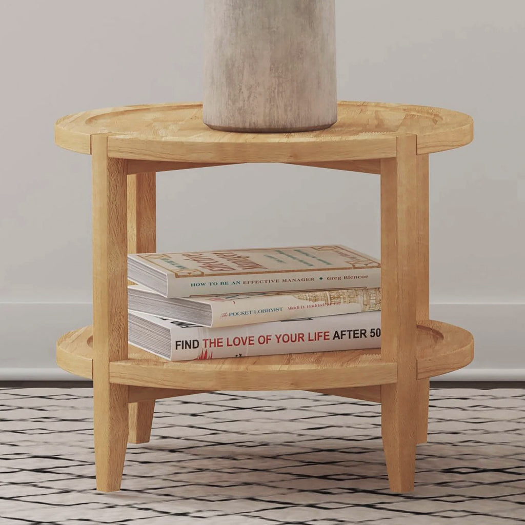 Maple Brown Round Wooden End Table with Shelf styled with books and a vase, showcasing its practical lower shelf for storage or display.