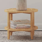 Maple Brown Round Wooden End Table with Shelf styled with books and a vase, showcasing its practical lower shelf for storage or display.