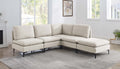 Beige linen upholstered modular sectional sofa with plush cushions and modern black metal legs in a bright living room.