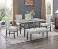 Selena Dining Set in gray faux marble with 60-inch table, 4 upholstered chairs, and bench in modern dining room setting.