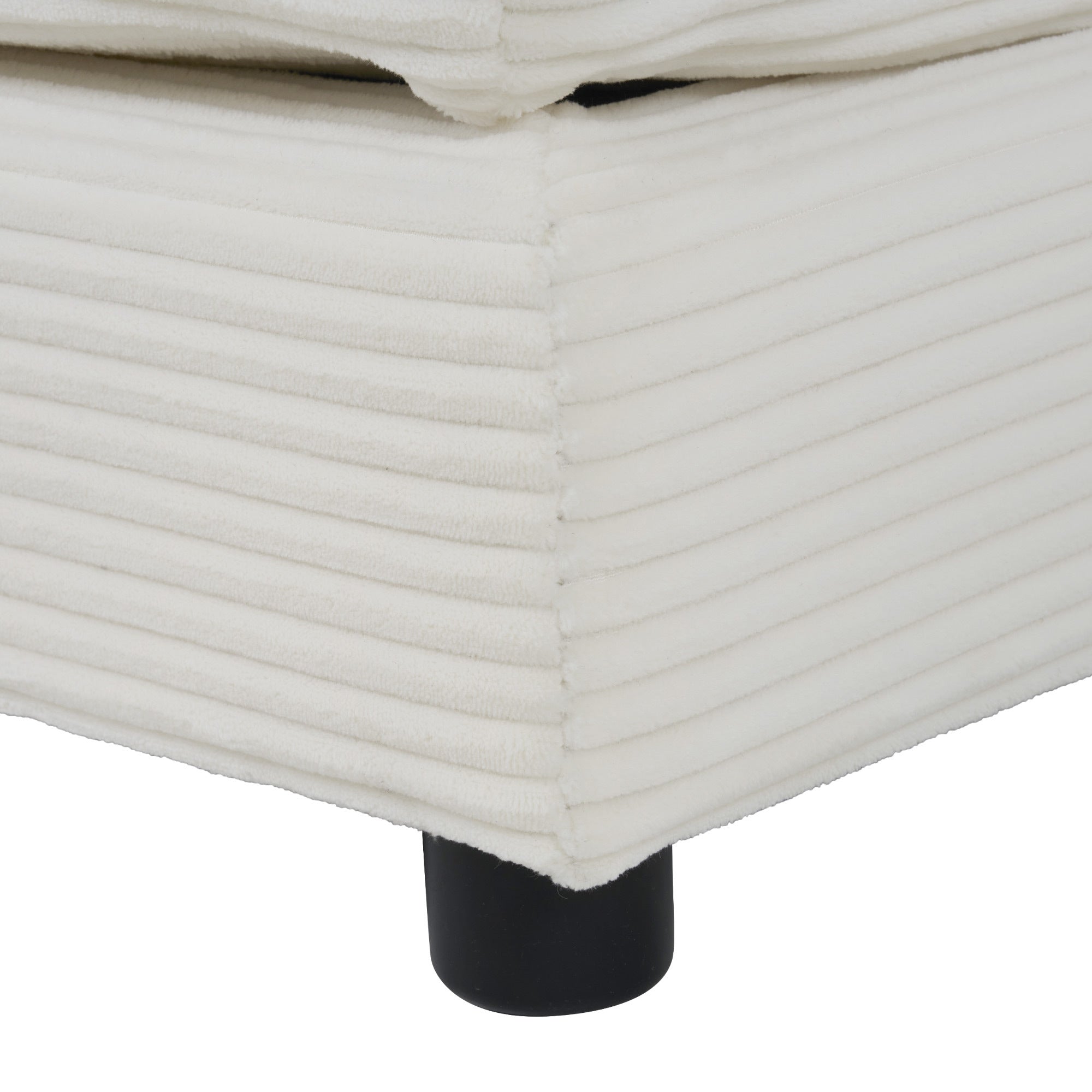 Base and leg detail of Modular Corduroy Sofa Beige - Stylish and Comfortable, showing ribbed fabric and black cylindrical legs.