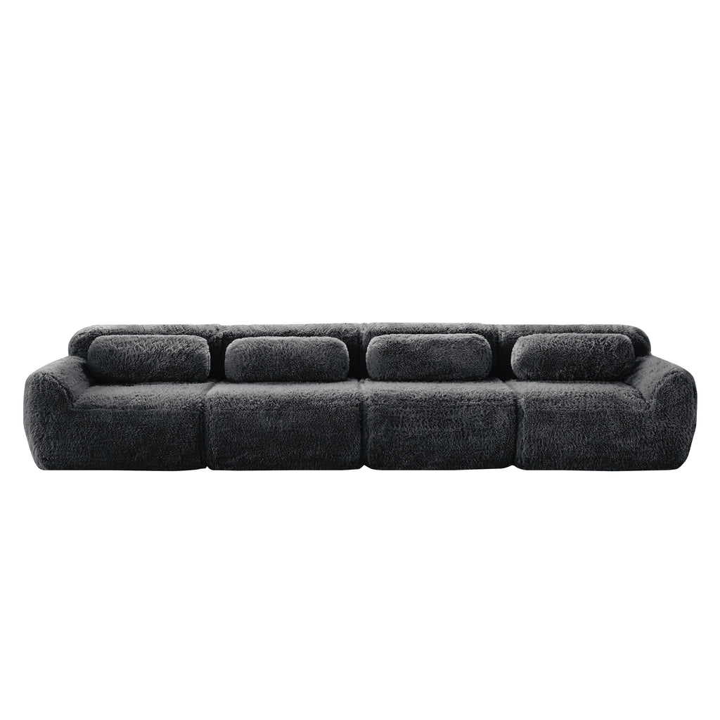 Front view of 149'' dark grey modular plush sofa featuring a seamless, low-profile design and ultra-soft fabric finish.