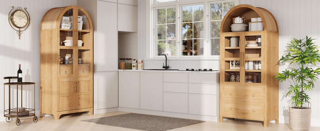 Pair of arched kitchen pantry cabinets in a modern kitchen, providing symmetrical storage with adjustable shelves and natural wood finish.