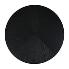 Top view of black round pedestal dining table showing wood grain pattern. Ideal for seating 4 in contemporary dining rooms.