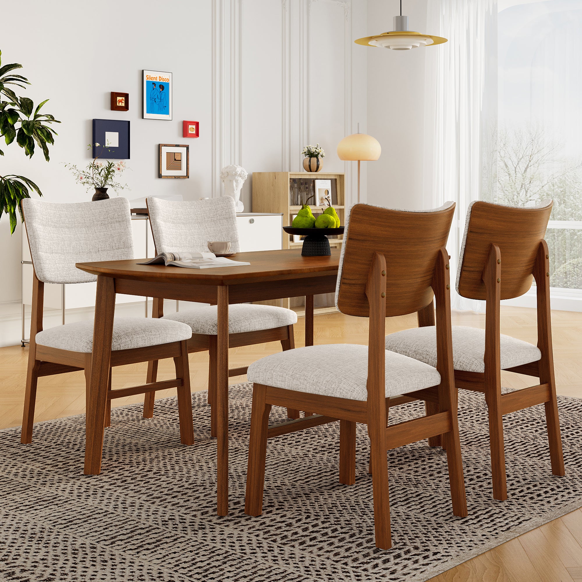 Back view of Mid-Century Modern Dining Chairs set of 4 around a wooden dining table in a modern interior.