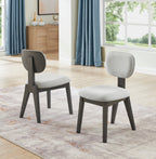 Pair of light gray upholstered dining chairs with dark wood frames from the Valencia 7-piece oval gray oak dining set.