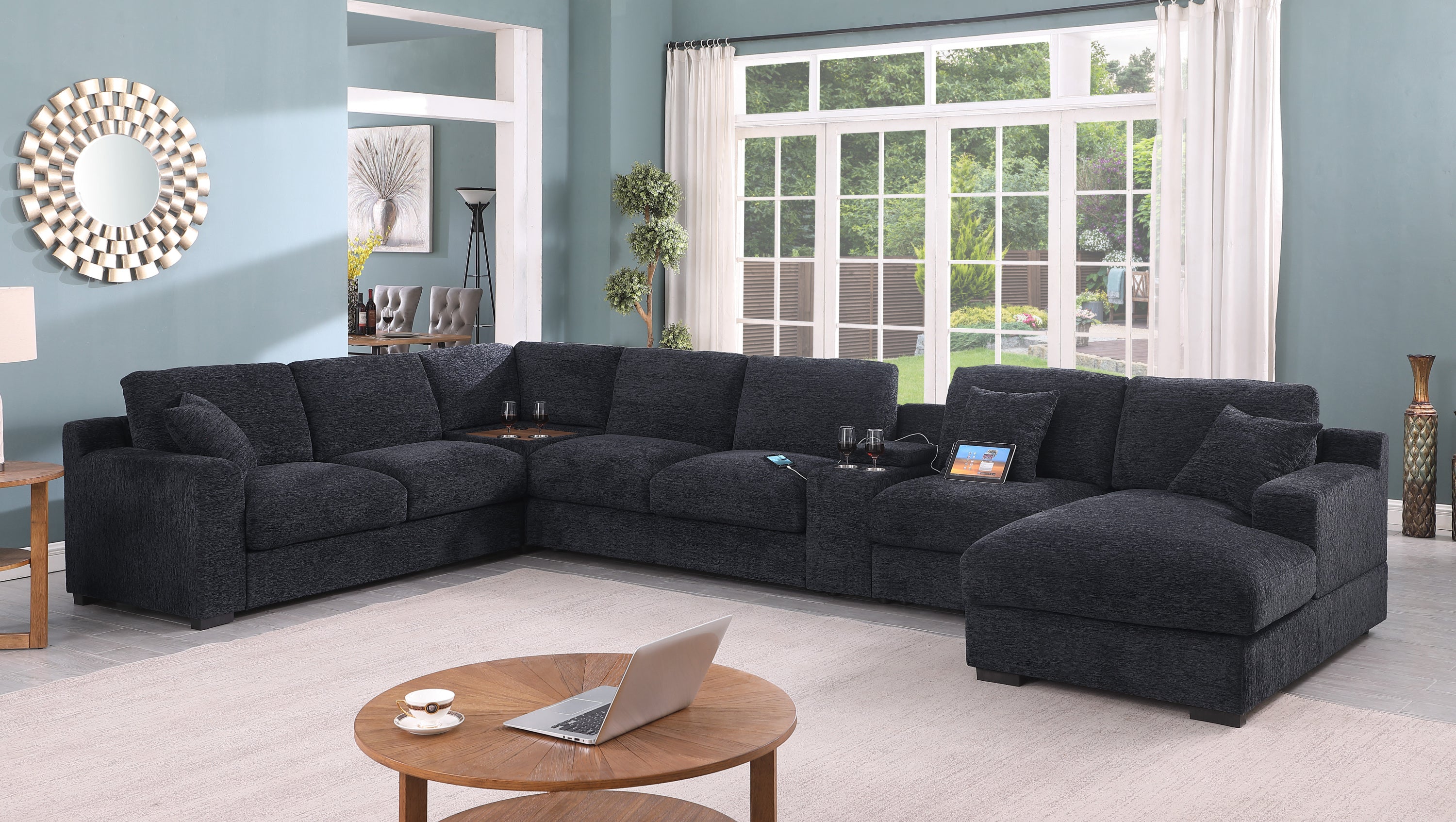 Celine dark gray sectional sofa with chaise, cupholders, and USB ports. Set in a modern living room with natural light and decor.