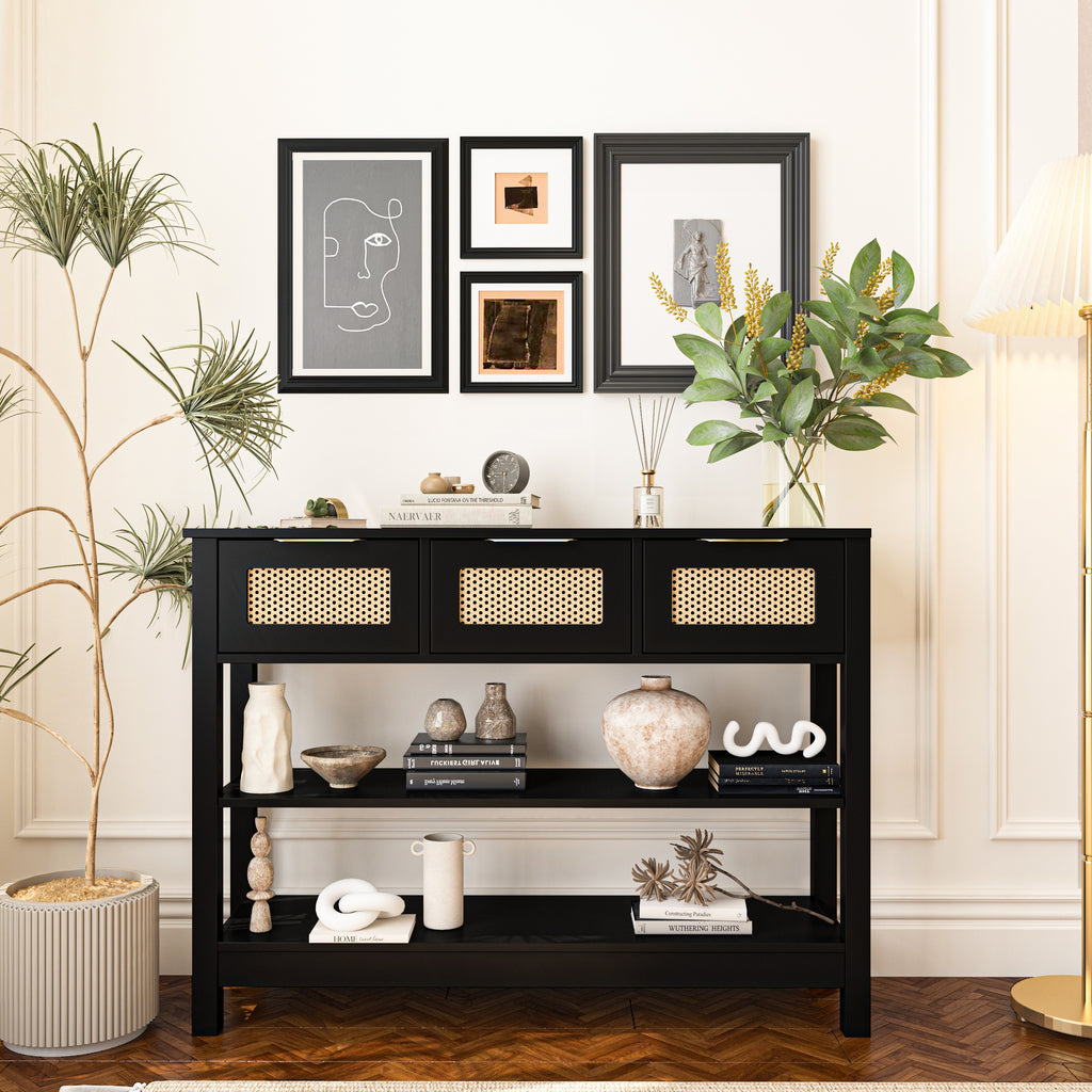 Black 43.3' farmhouse console table with rattan drawers and open shelves, styled with books and vases in a chic living space.