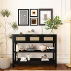 Black 43.3' farmhouse console table with rattan drawers and open shelves, styled with books and vases in a chic living space.