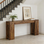 Minimalist dark brown wooden console table with a thick, sturdy frame, placed against a wall by a staircase.