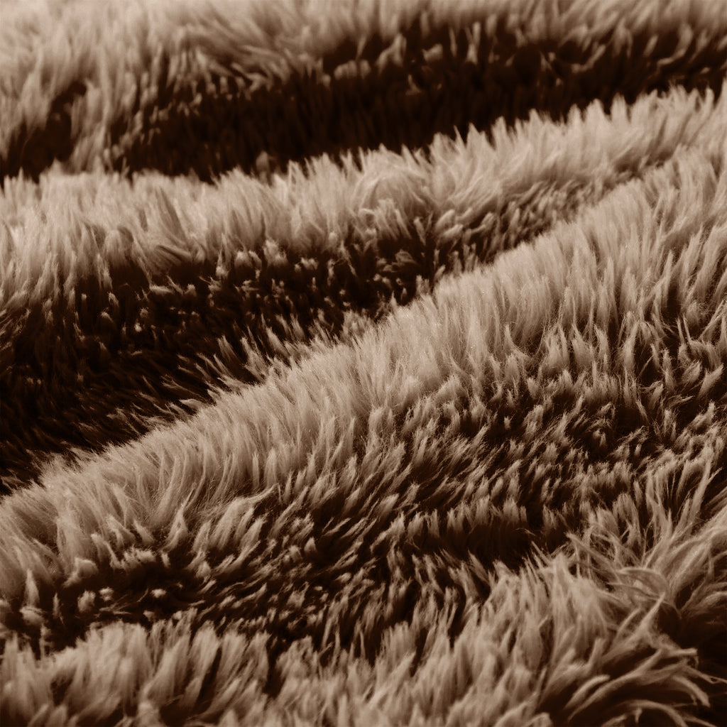 Detailed view of fluffy fabric on chocolate modular sofa 3-seater, showcasing its cozy and high-quality upholstery.