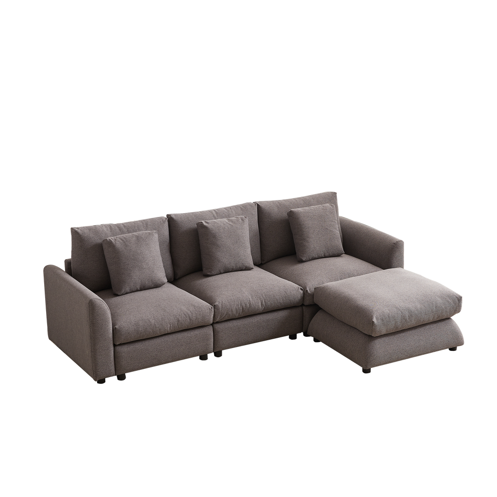 Three-seat modular sofa with right-side ottoman, upholstered in gray fabric and paired with four matching pillows for a cozy, modern look.