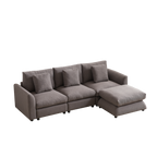 Three-seat modular sofa with right-side ottoman, upholstered in gray fabric and paired with four matching pillows for a cozy, modern look.