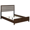 Modern walnut queen bed frame with a taupe upholstered, foam-cushioned headboard and sleek engineered wood finish.