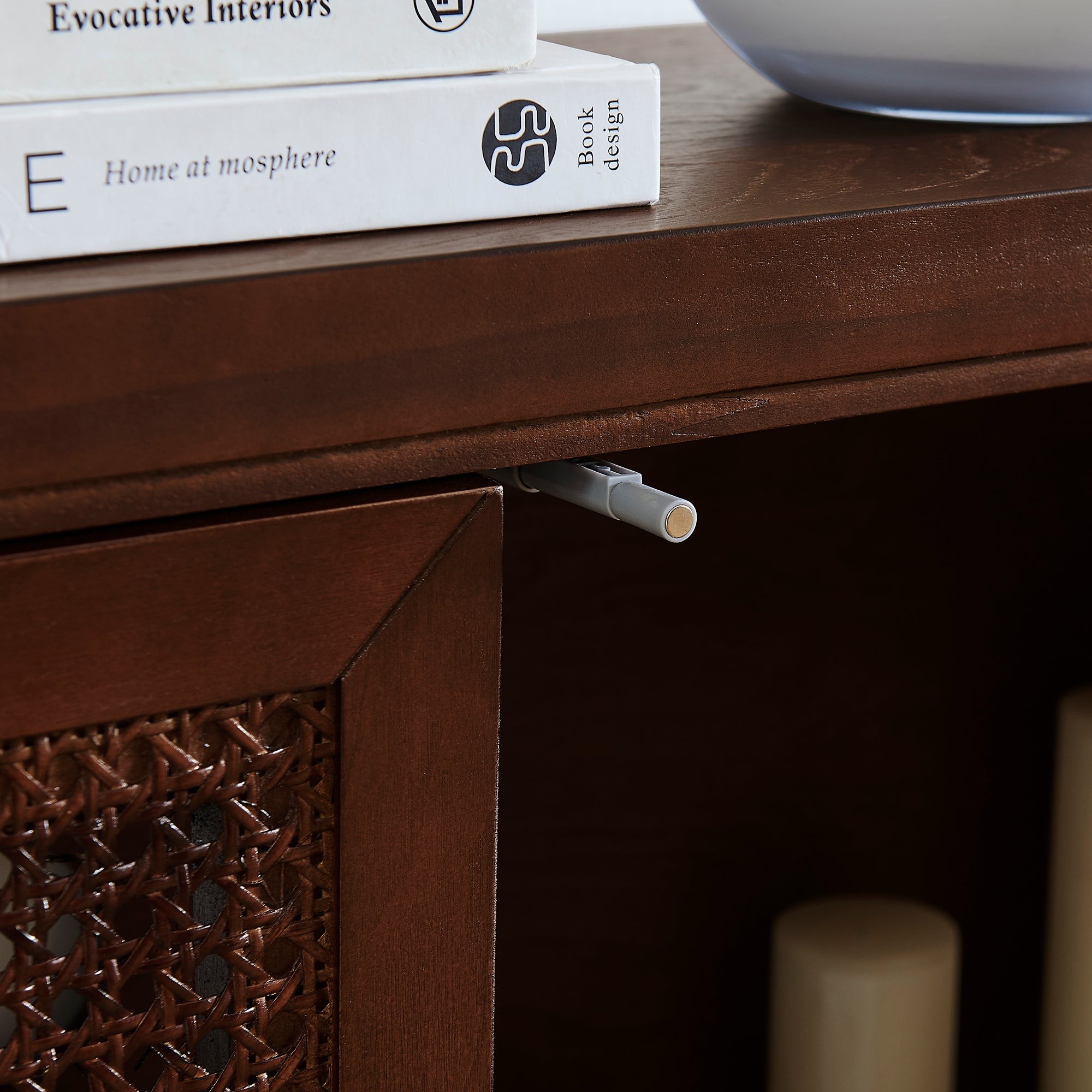 Detail of pop-up door mechanism on Mid Century Rattan Sideboard Cabinet, highlighting functional and modern design.