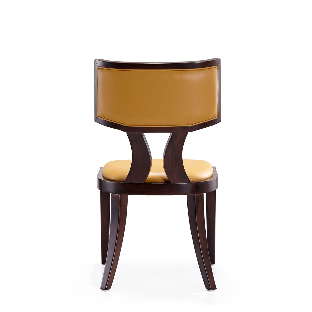 Back view of camel wood dining chair showing dual curved supports and full faux leather backrest in camel color on solid beech frame.