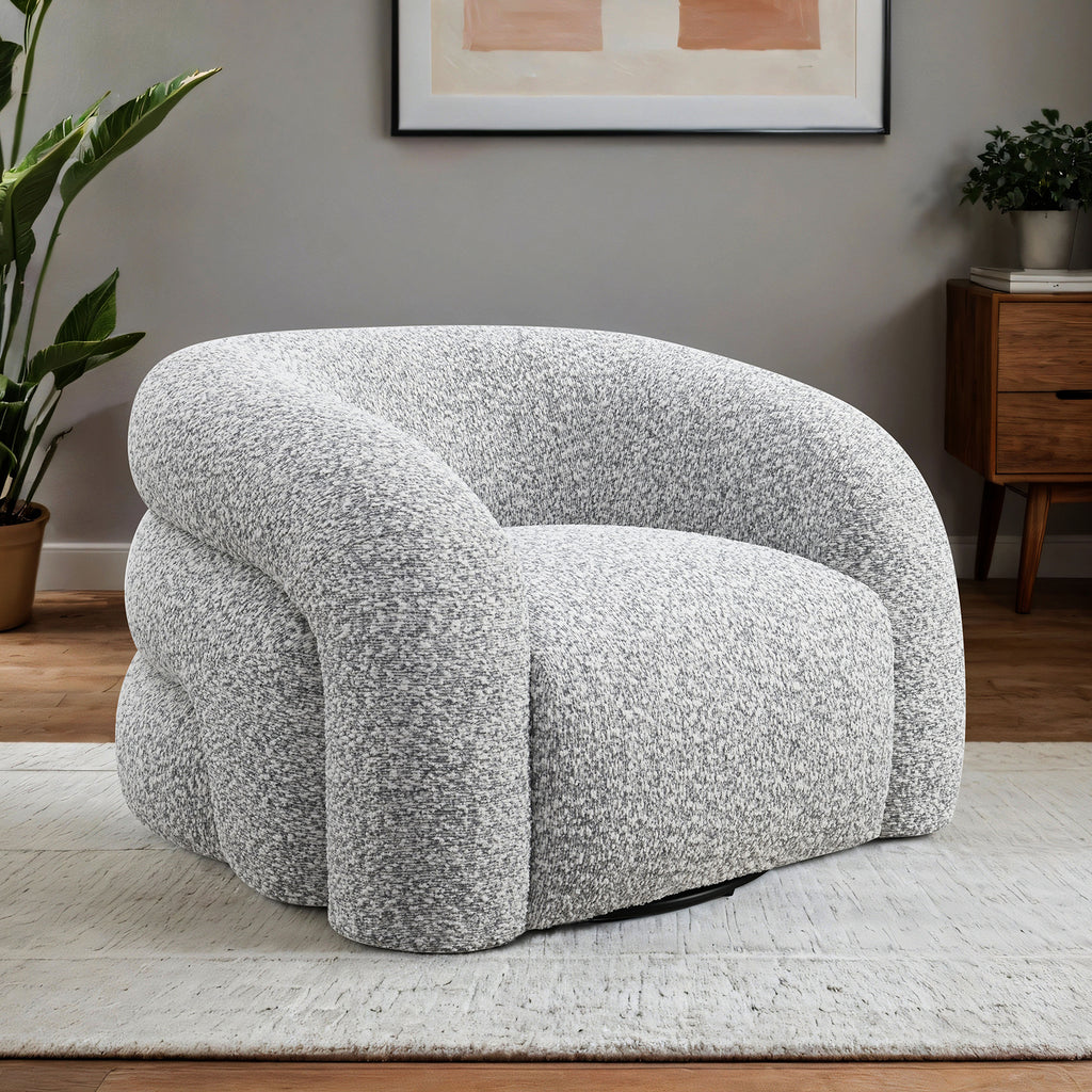 Contemporary Swivel Chair in gray with 360° rotation, shown in a cozy interior setting with modern decor and soft lighting.