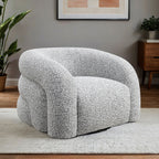 Contemporary Swivel Chair in gray with 360° rotation, shown in a cozy interior setting with modern decor and soft lighting.