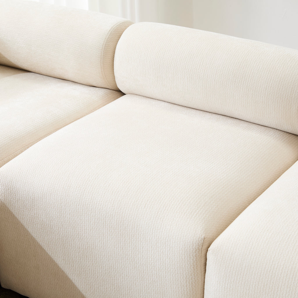 Close-up of the seat and backrest of the Evelyn U-Shaped Modular Sectional Sofa, highlighting the soft chenille texture and plush cushioning.