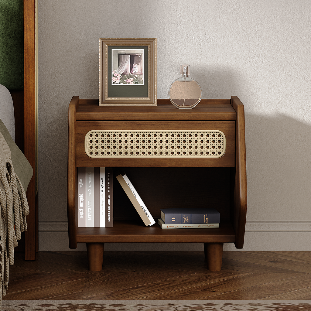 Mid-century modern walnut nightstand featuring a woven rattan drawer front, open storage shelf, and tapered legs.
