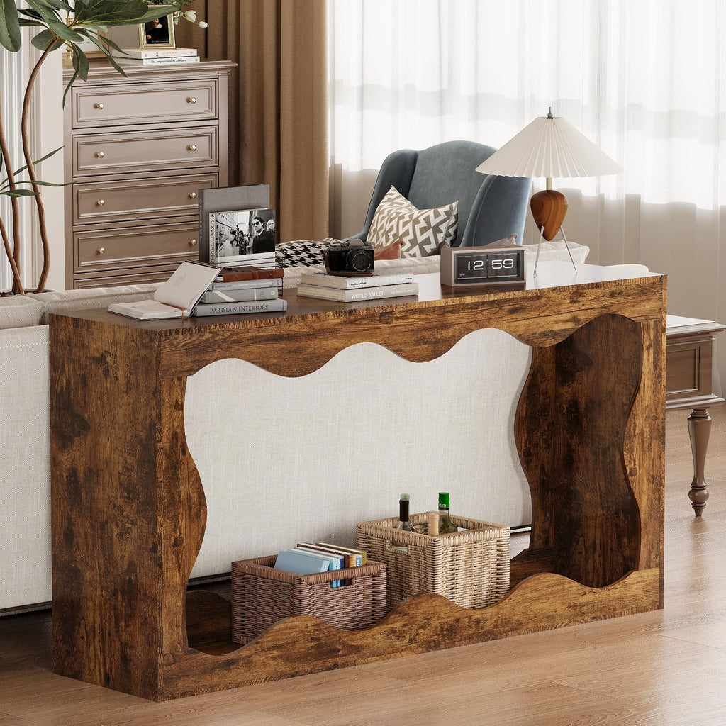 Rustic brown farmhouse console table with a unique curvilinear design, positioned behind a living room sofa.