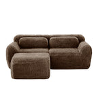 Front view of plush chocolate L-shaped modular sofa with ergonomic backrest and deep seating. Ideal for modern living rooms with comfort focus.