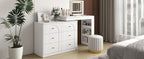 Stylish vanity desk with mirror and lights in bright bedroom, featuring flip-top makeup table and gold-accented drawers.