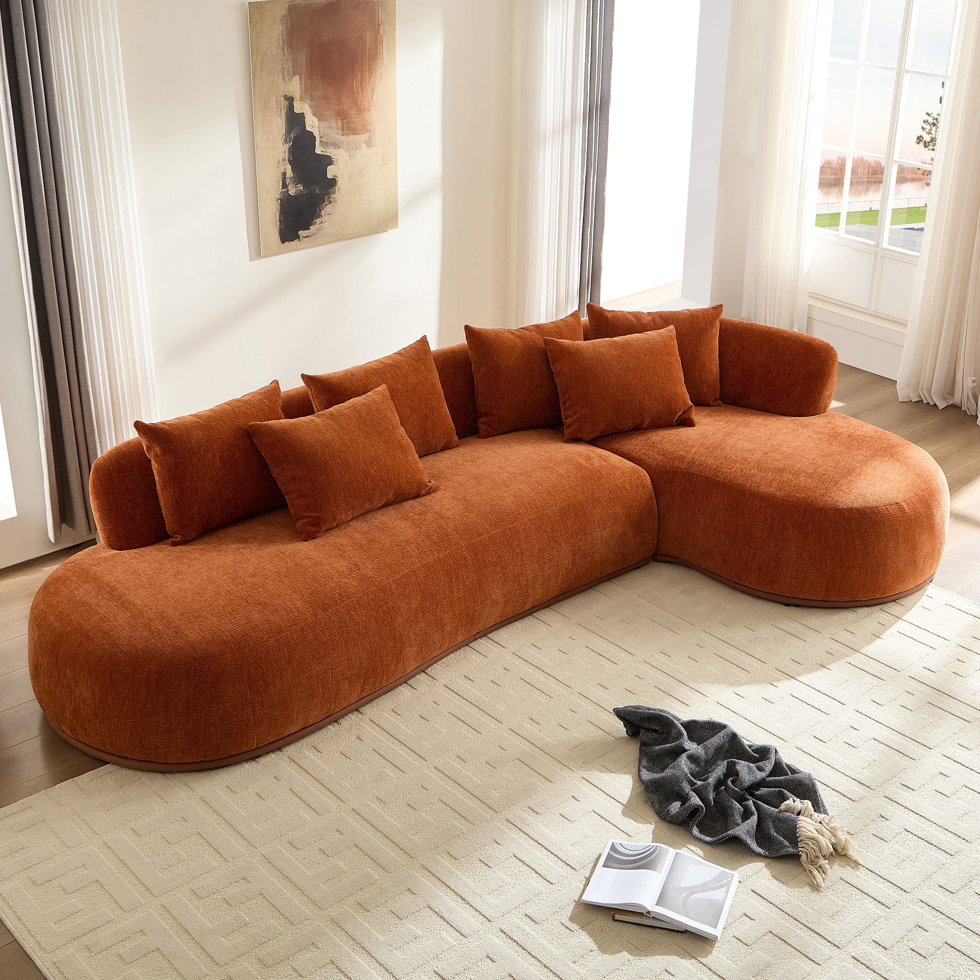 Modern Oversized L-Shape Sectional Sofa placed in a bright living room, showcasing deep seating and elegant curved design with plush cushions.
