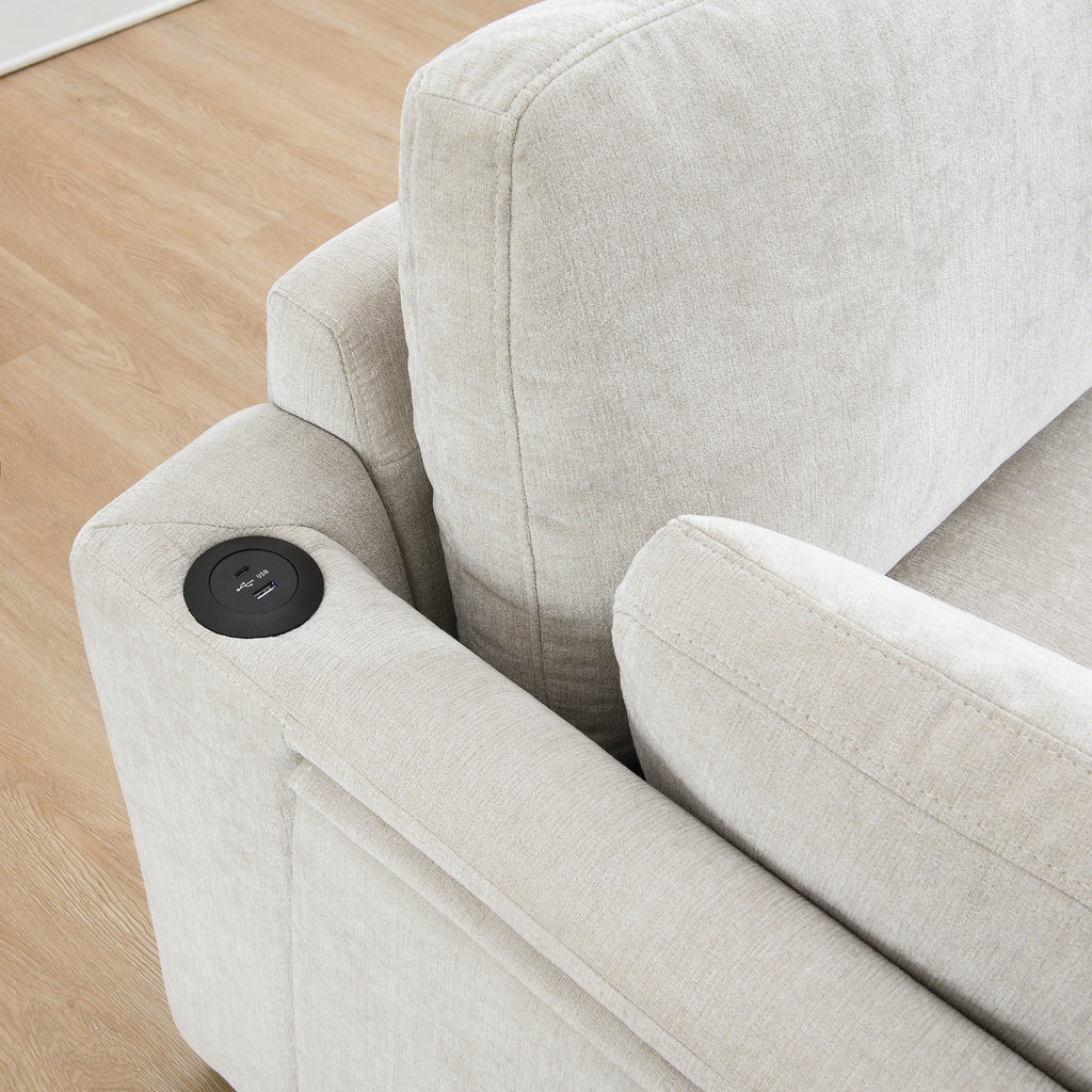 Close-up of dual-port charging station integrated into the armrest of the modular sectional sofa.