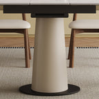 Close-up of the leather-wrapped stainless steel base of the expandable dining table, emphasizing modern and sturdy construction.