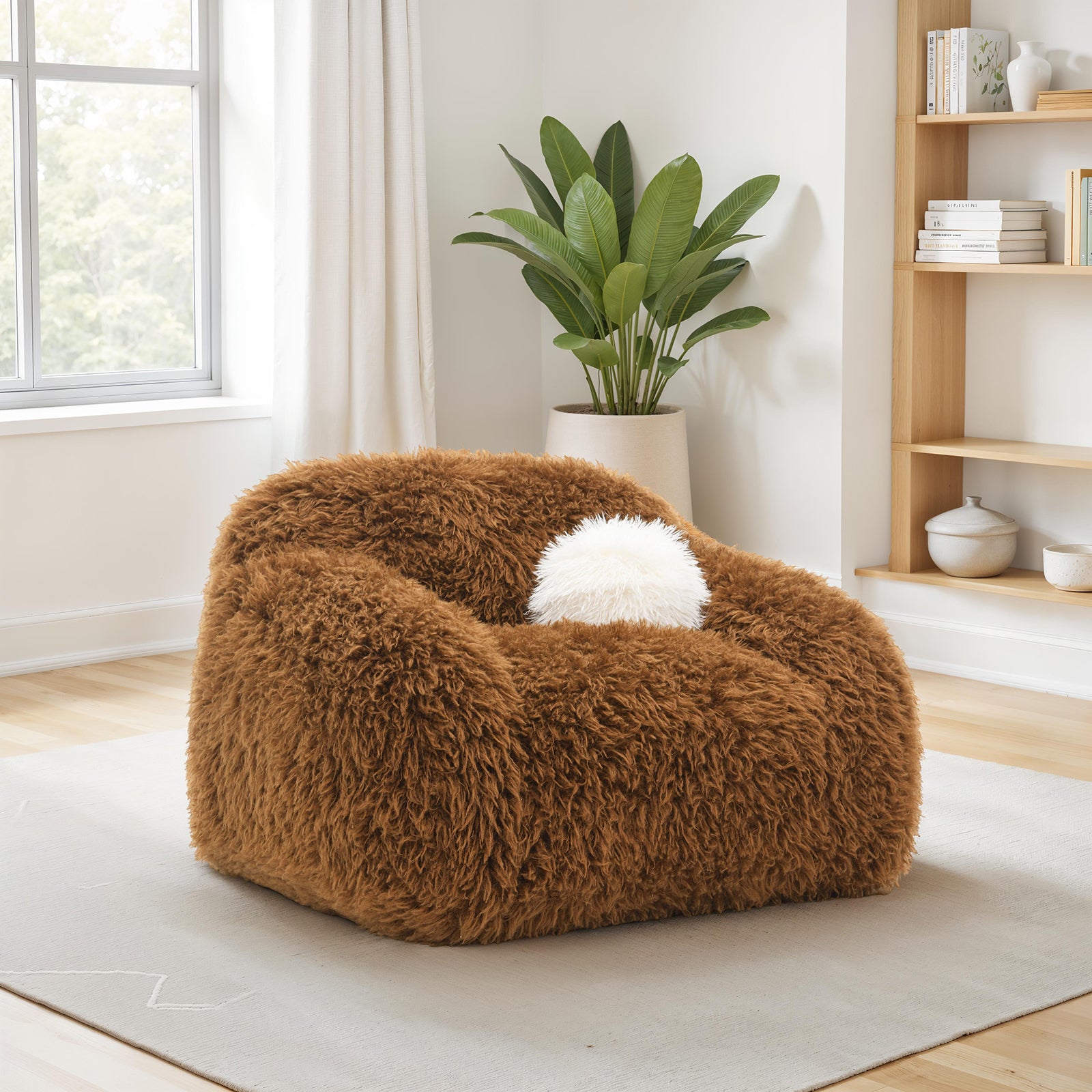Accent Swivel Chair in camel brown faux fur with white pillow, placed in a modern living room with natural light and minimalist decor.