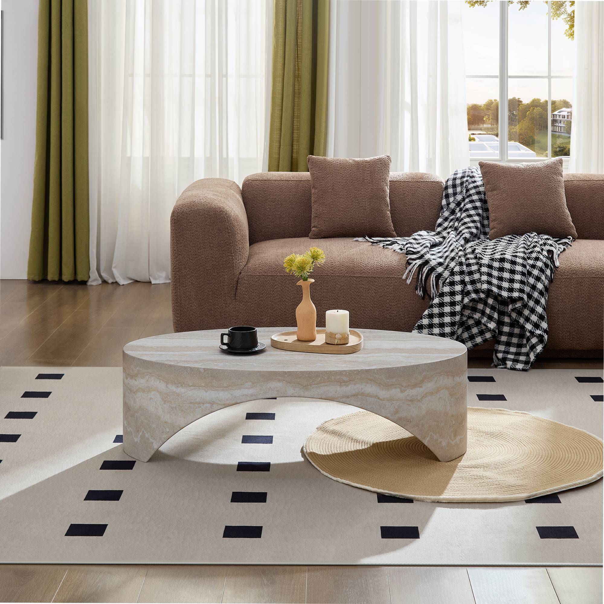 Oval marble coffee table in front of a brown sofa, creating a chic centerpiece for contemporary living room elegance.