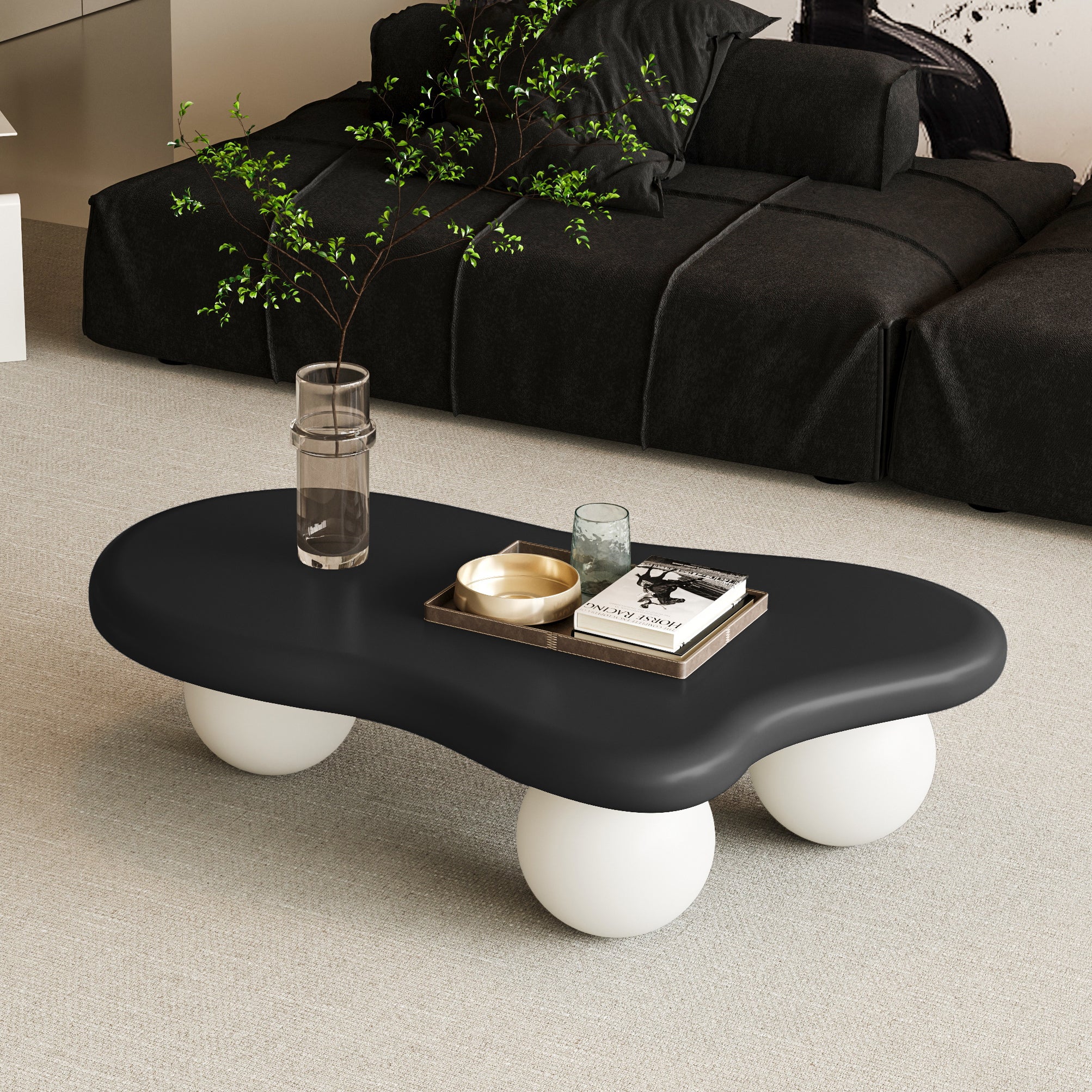 Black top Cloud Shaped Coffee Table with white spherical legs in a minimalist living room. Ideal for accenting modern furniture collections.