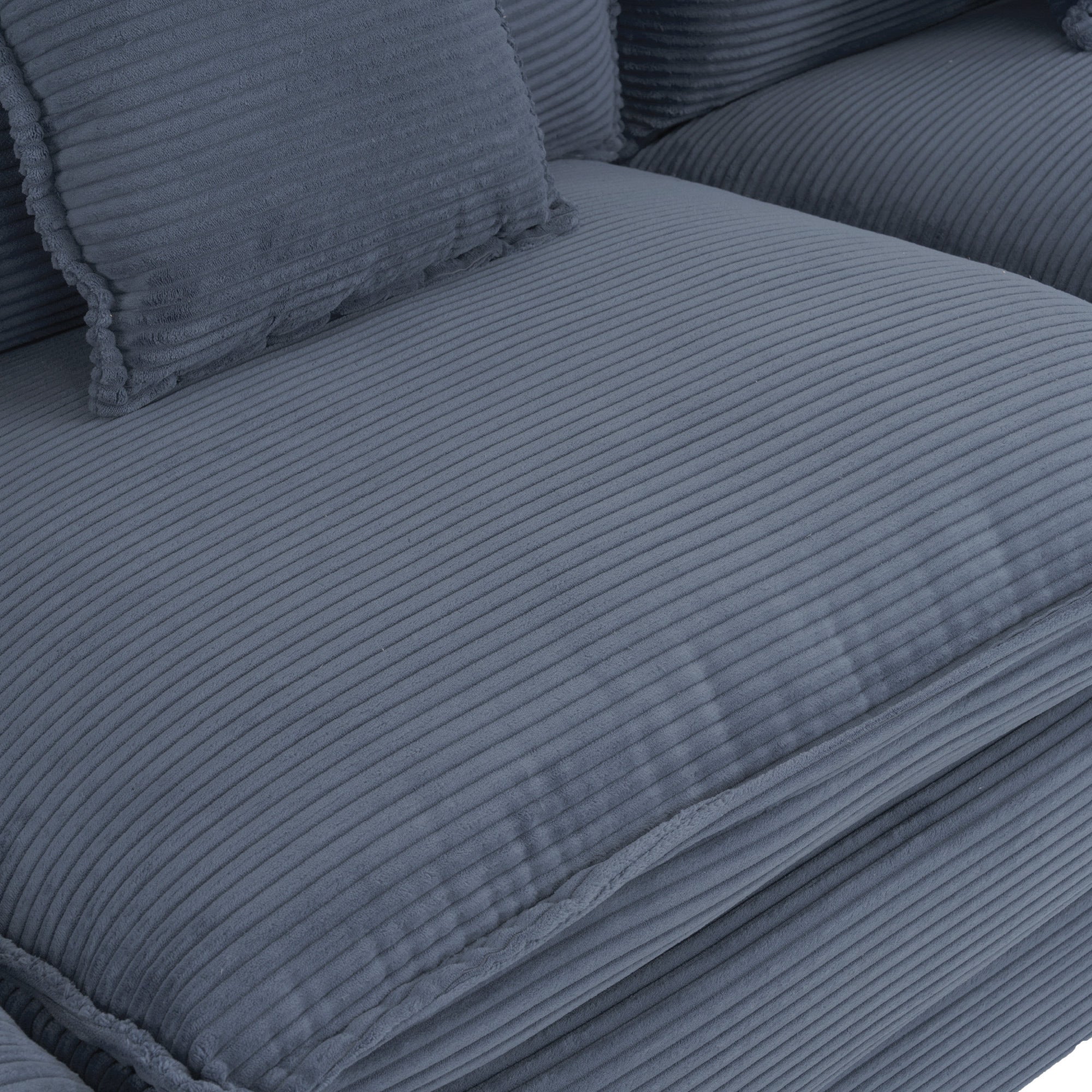 Detailed view of the blue corduroy seat cushion with ribbed texture. Designed for comfort and modern aesthetics in living room furniture.