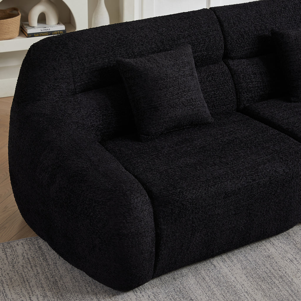 Armrest and cushion detail of Modern Black Modular Sofa, showing curved design and rich chenille texture for luxury seating.