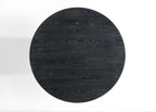 Top-down view of Jasper round dining table in ebony black wood. Showcases natural wood grain pattern and circular shape.